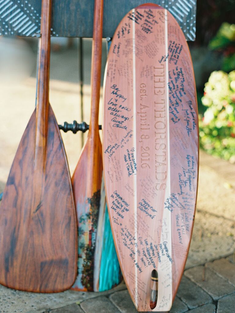 Vintage surfboard guest list at tropical wedding