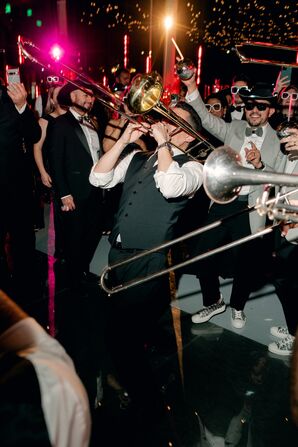 Trombone Player During Wedding Reception Dancing