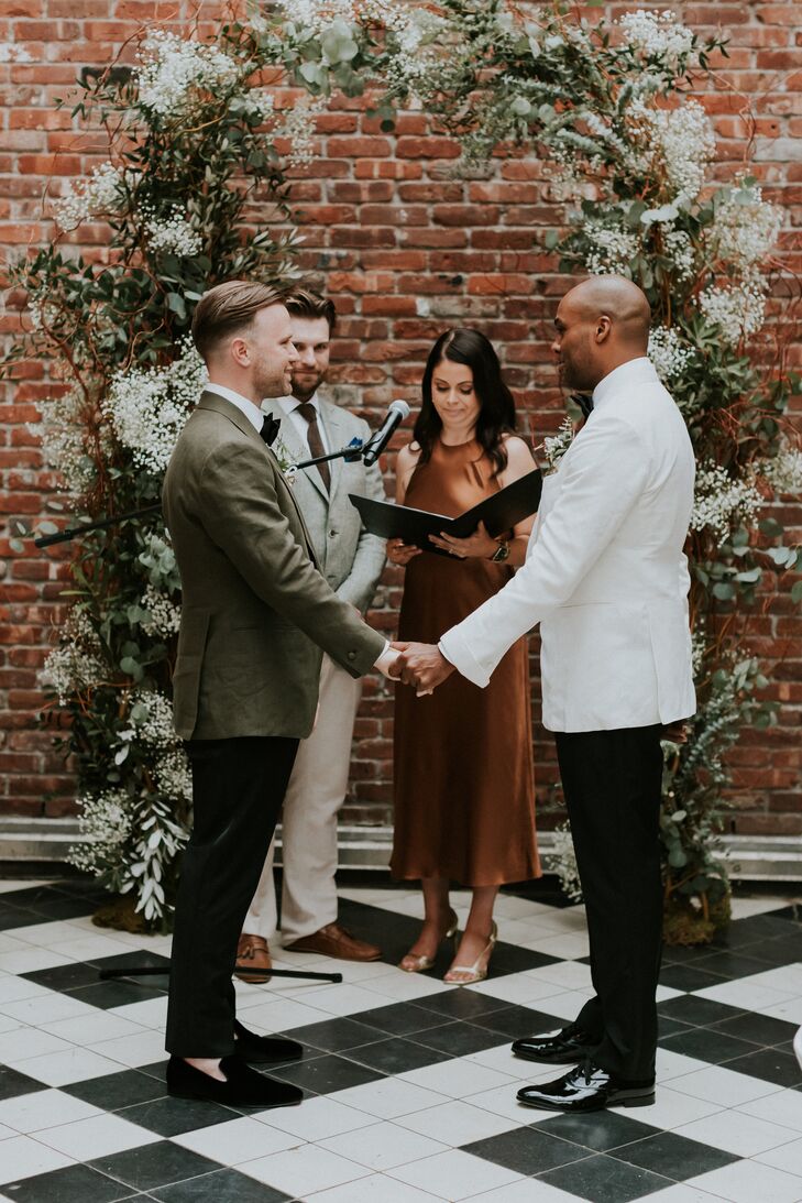 Grooms in White and Green Suit Jackets Marry in Exposed Brick, Industrial Setting