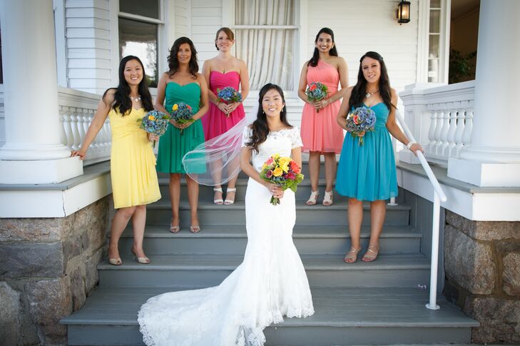Eriko’s bridesmaids each wore a different colored gown in a vibrant shade of the rainbow from David’s Bridal.
