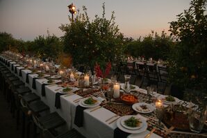 Long Dining Tables in Lemon Grove, Candles and Intricate Patterned Runner With Slim Blooms, Low Light