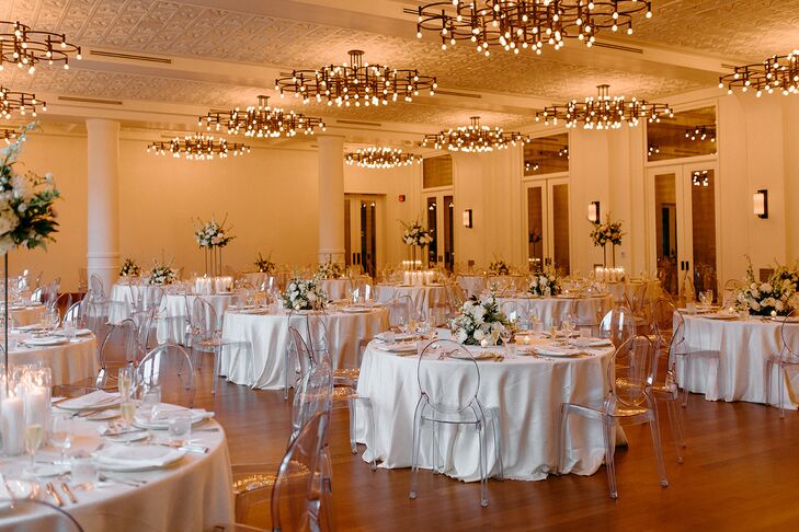 Ballroom Wedding Reception With Ghost Chairs and White Linens