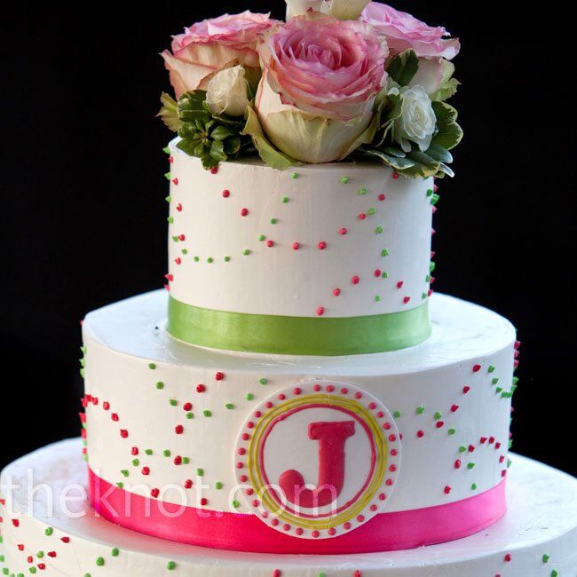 The cake was spotted with pink and green polka dots and branded with the couple’s “J” monogram.