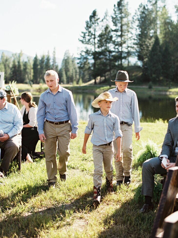 "Since we were having a smaller and more intimate wedding, we decided to forgo a traditional wedding party. Instead, the groom's brother, the bride's three older brothers, all seven of their nieces and nephews (as well as best friends from high school and college) were all involved in special ways," the bride says. "The family all wore navy blue."