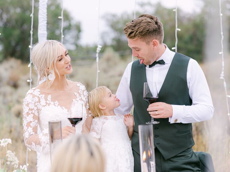 Family toasts during wedding outdoor reception