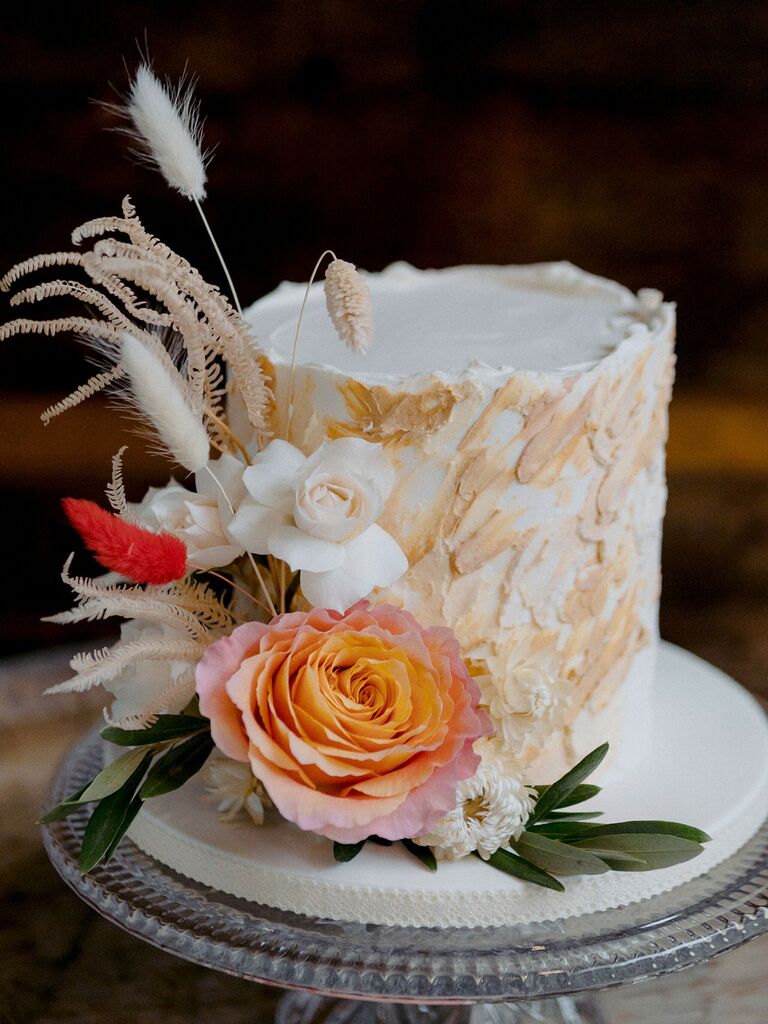 small boho wedding cake with flowers and textured buttercream