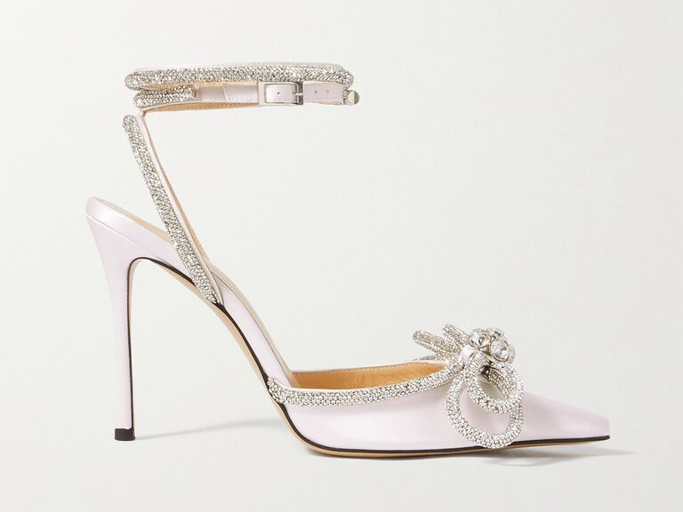 Sleek satin pumps with crystal bows on the toe. 