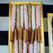 For wedding favors, Raquel and her mother made white-chocolate-dipped pretzels, along with heart-shaped sugar cookies, doughnut holes, Oreo and peanut butter pretzel truffles and assorted candies. All of the take-home desserts went along with the wedding day color palette.