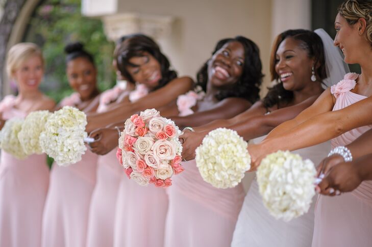 Chantel complemented her wedding dress with a romantic pink rose bouquet and curled side-swept hairstyle.