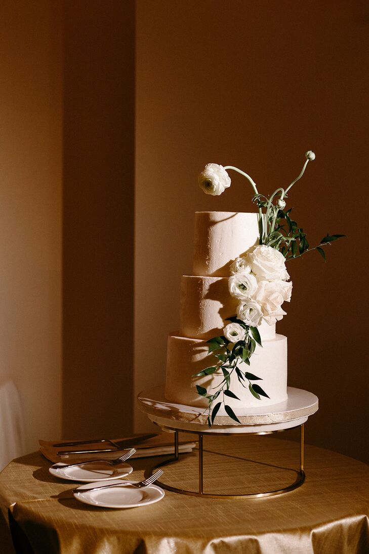 Three-Tier White Wedding Cake With White Cake Flowers