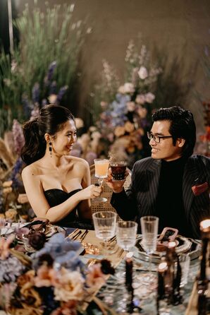 Bride and Groom Toasting With Cocktails During Reception