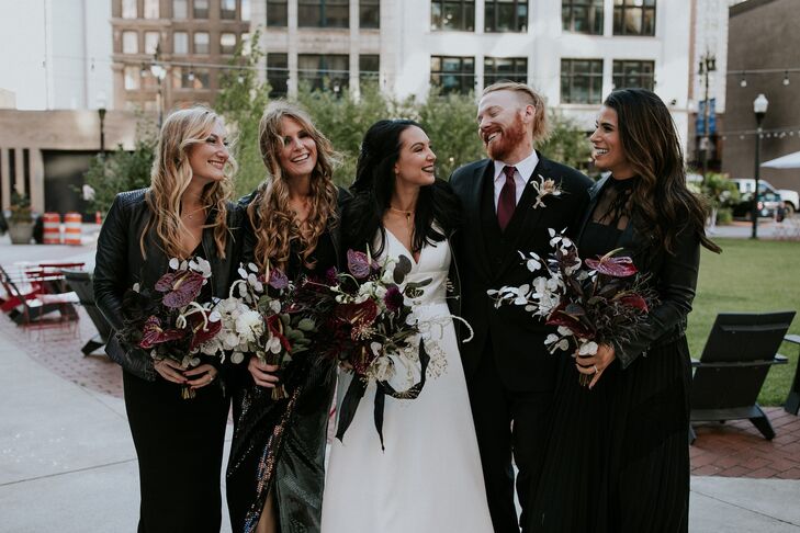Alternative Wedding Party with Black Dresses and Moody Bouquets
