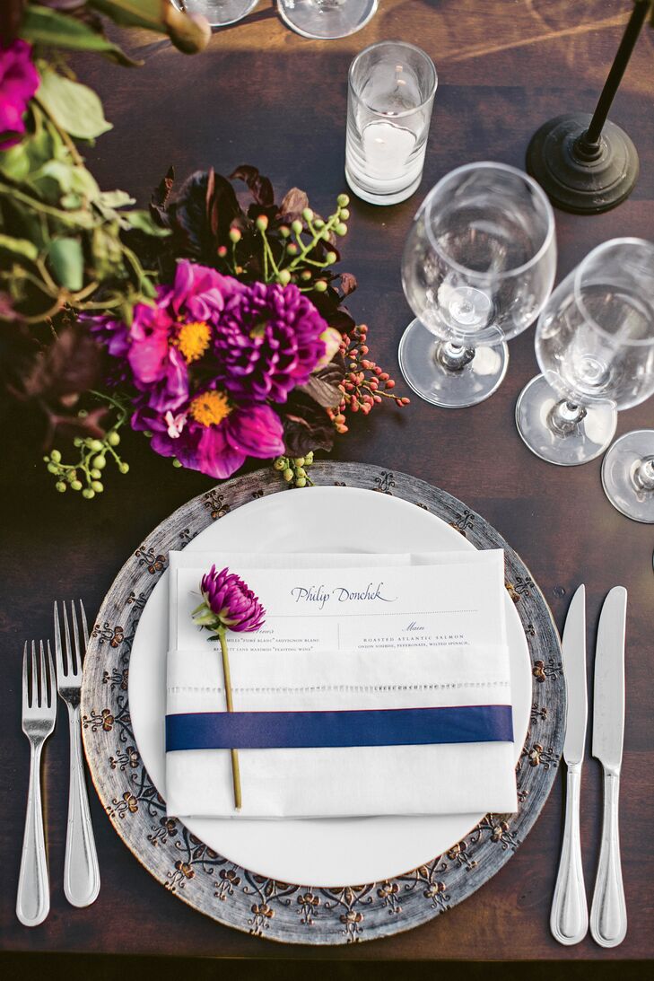 The menu cards were tucked into ivory napkins topped with single dahlia blooms and wrapped with a blue French ribbon.