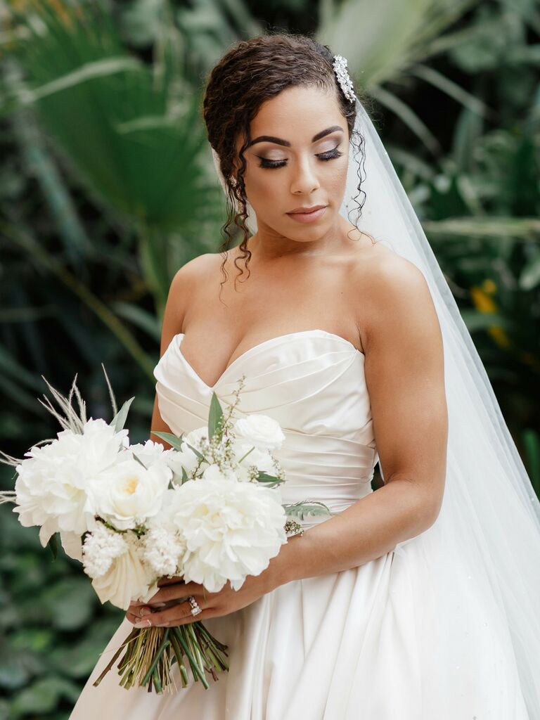 curly wedding hairstyles low bun with sparkly hair accessory
