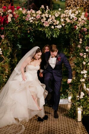 Breaking the Glass Under Romantic Flower Arch