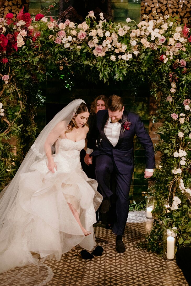 Breaking the Glass Under Romantic Flower Arch