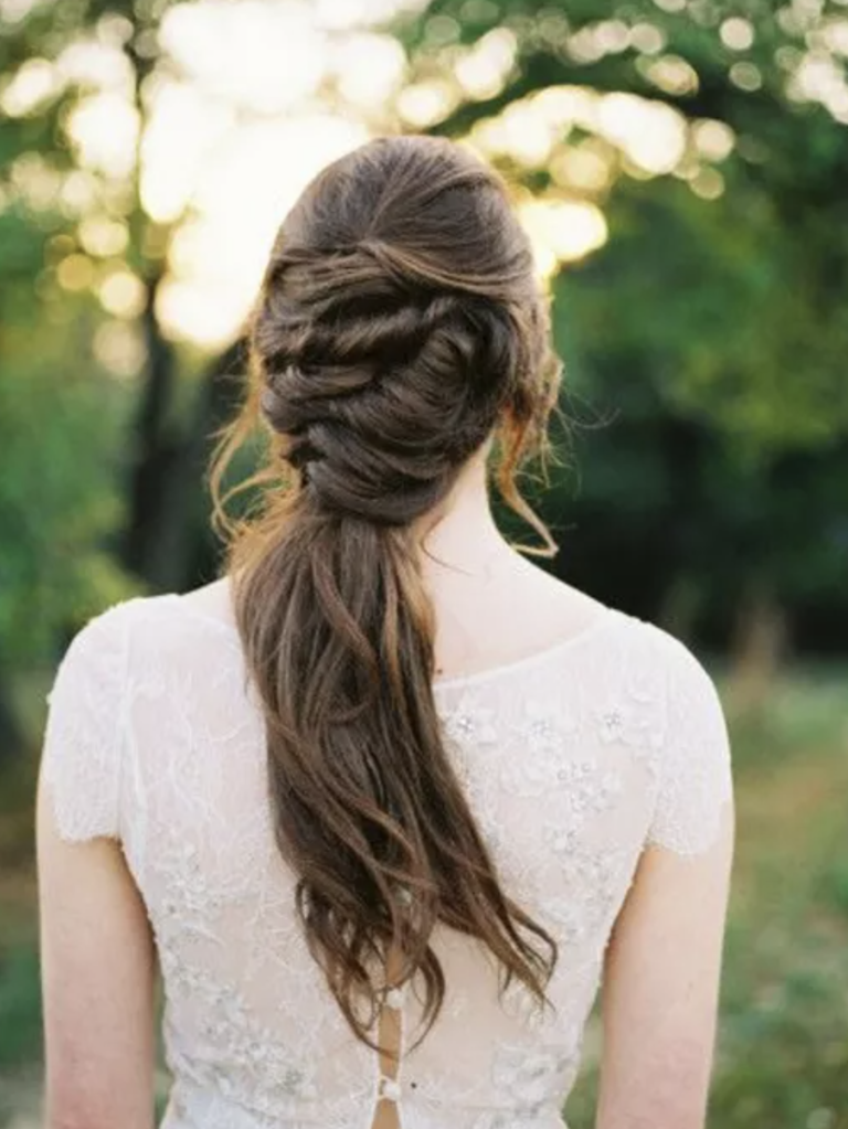 bride with braided updo into ponytail
