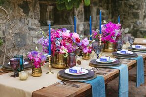 Dining Table with Pink Flowers and Blue Candles