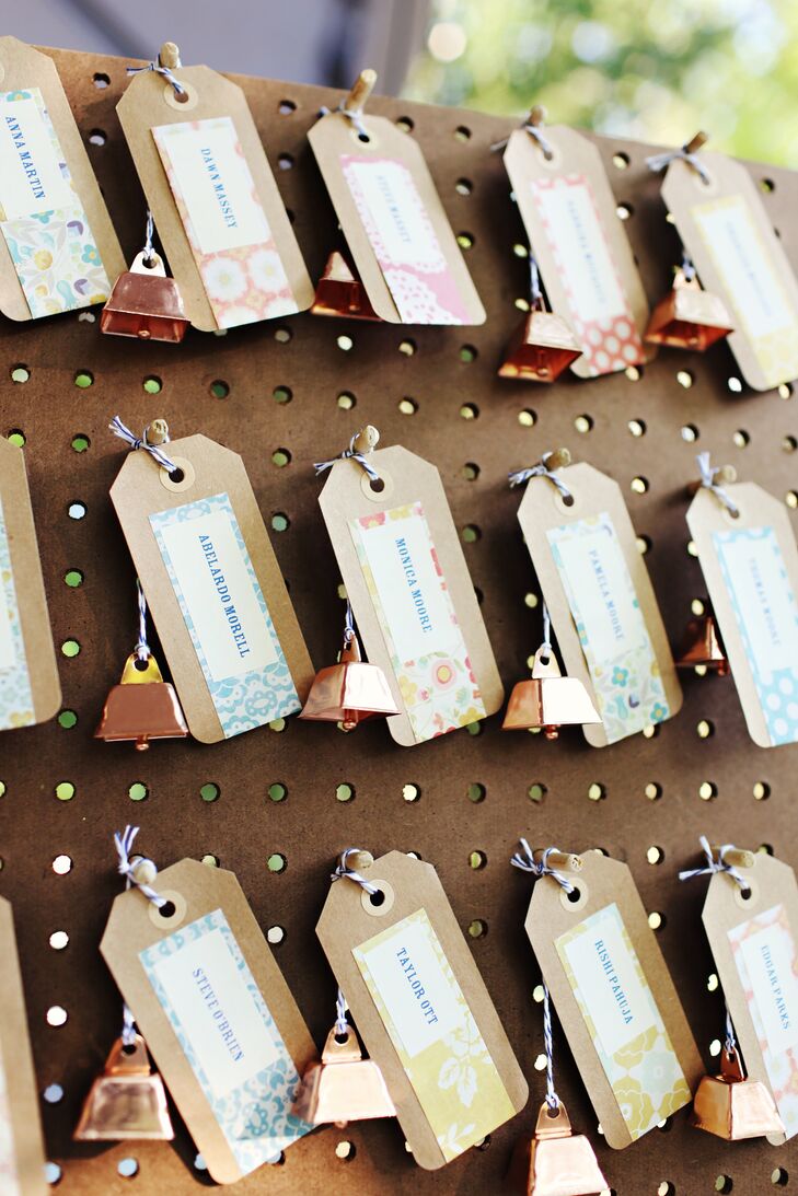 The escort cards were really fun to make, says Aimee. Each name was printed on a card stock tag and attached with bakers twine to a mini copper cowbell--a fun, rustic twist on a traditional wedding bell.