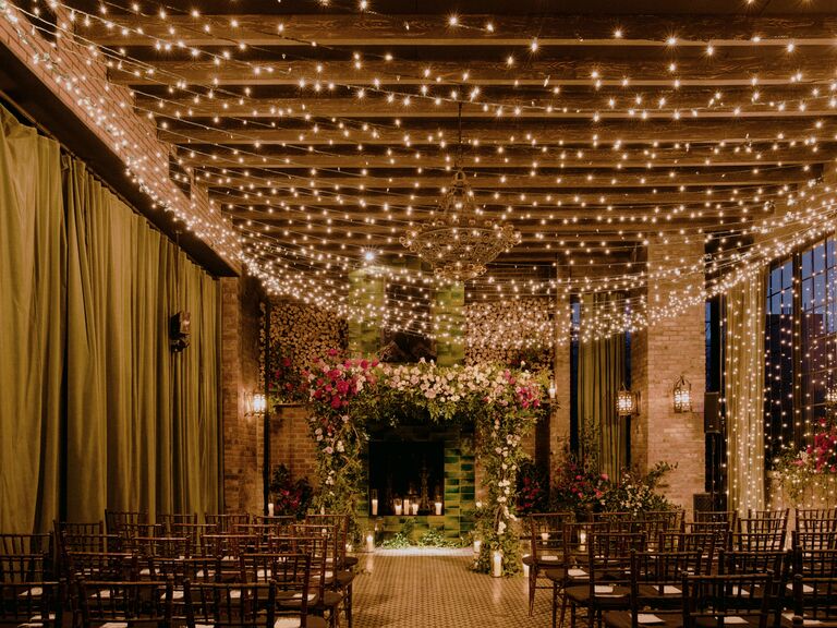 indoor wedding ceremony with twinkle light strands draped across ceiling