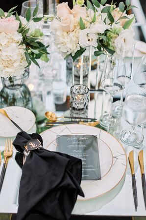 Glam Place Setting With Black Napkin, Gold Flatware and Marble-Inspired Dishware