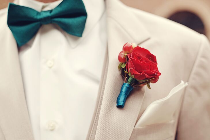 Steven's boutonniere was a single rose with a teal blue wrap that was pinned to his white jacket.