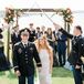Bride and Groom During Recessional Under Military Swords