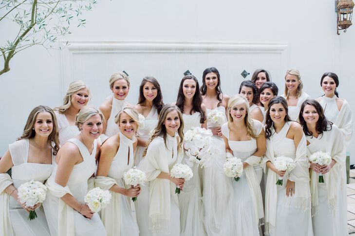 Blakeney’s maid of honor and matron of honor wore ivory Monique Lhuillier tulle trumpet-style gowns, while the other bridesmaids donned an array of ivory Monique Lhuillier chiffon gowns. “I wanted my friends to feel beautiful in their bridesmaid dresses. I chose different styles and let them pick the dress they wanted,” Blakeney says. “I loved that they all looked different but that their dresses were ivory.”