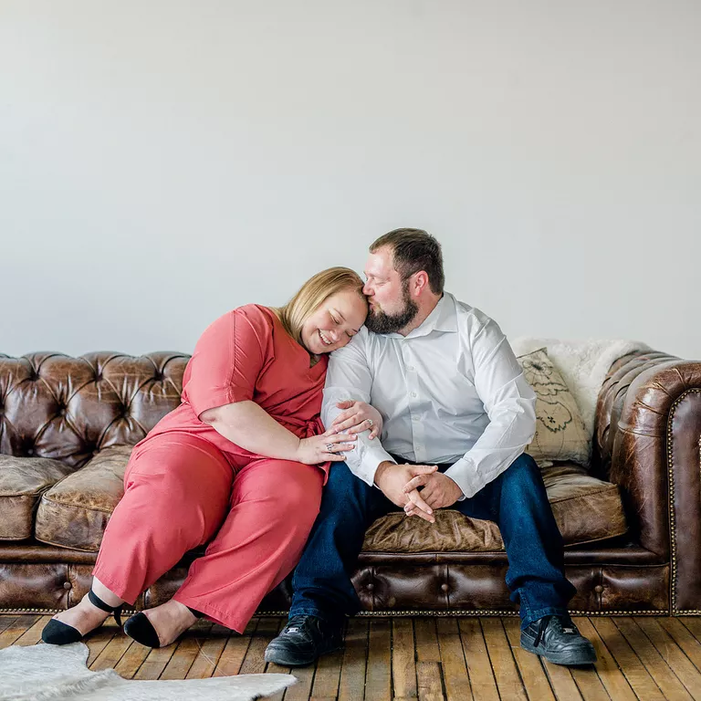 An intimate moment snuggling engagement photo