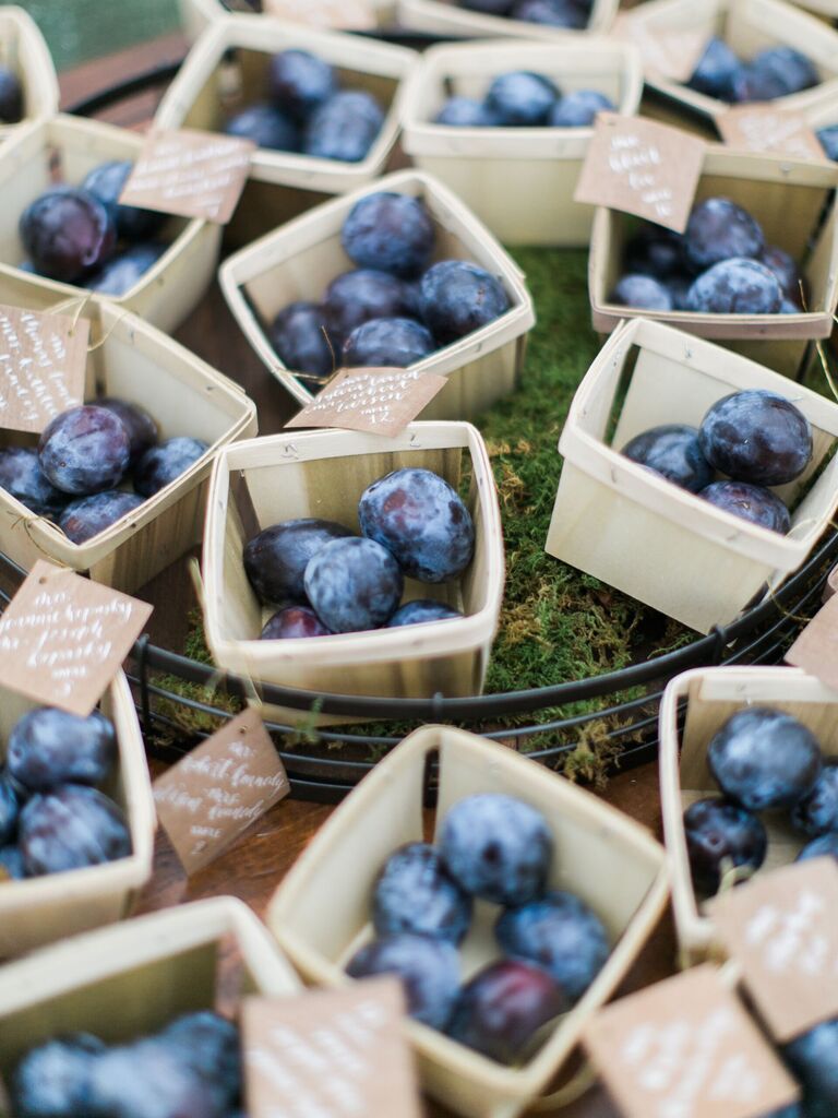 mini wooden baskets with fresh plums