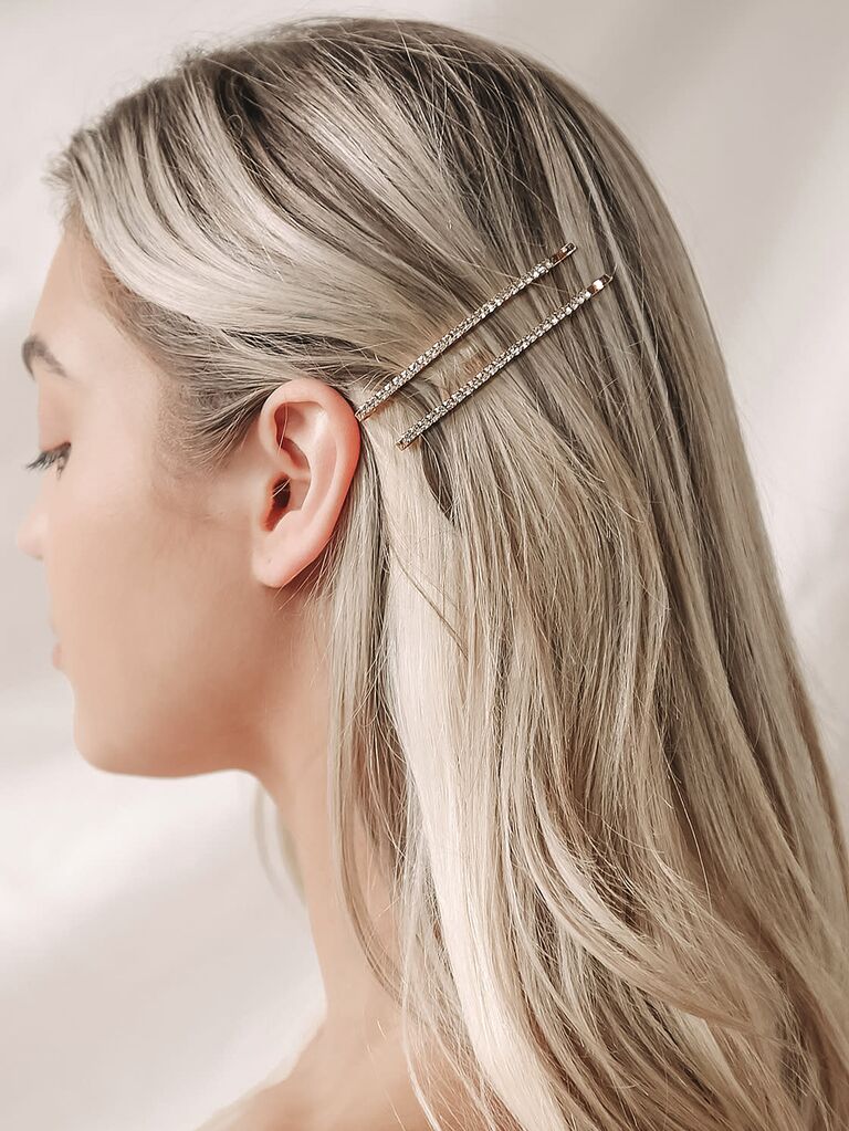 Model wears bedazzled pins in her blonde hair. 
