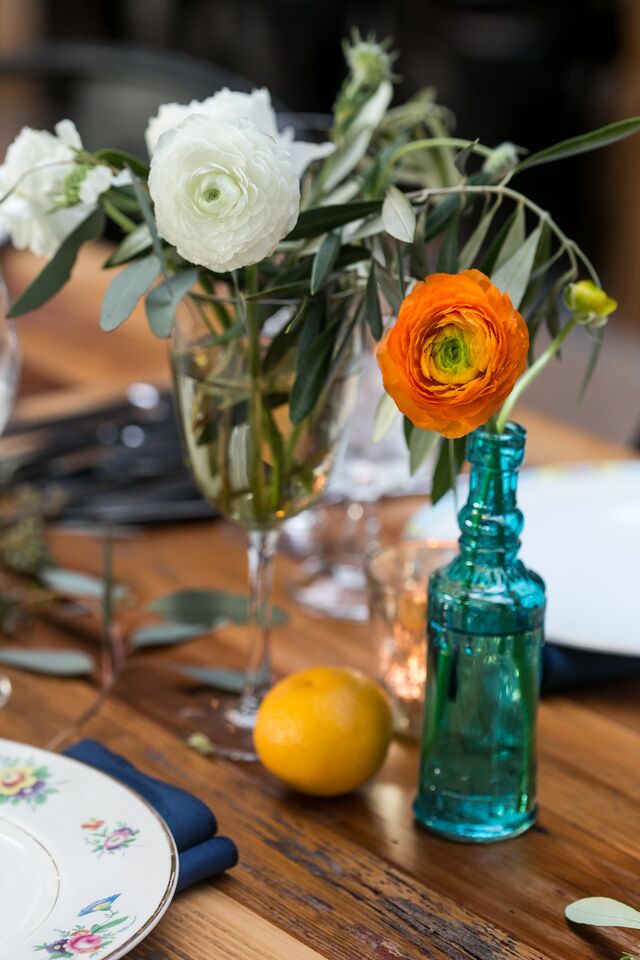 Marla and Trevin included citrus in their centerpieces "for a fun edge," the bride says.