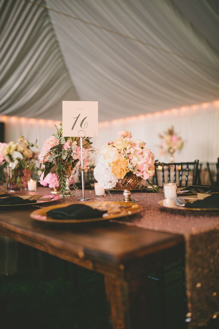 "To achieve the soft and romantic vibe I desired, I worked with my wedding planner to let blush pink shine as our main color and accented it with touches of ivory, gold and even black. We opted for a large draped tent and included wooden farm tables and sequin linens to help combine the aesthetics."
