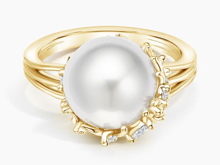 Pearl and diamond ring with thin links creating botanical features 