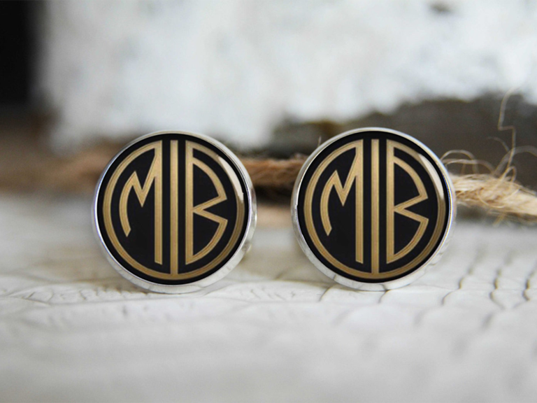 Round black cuff links with retro gold monogram