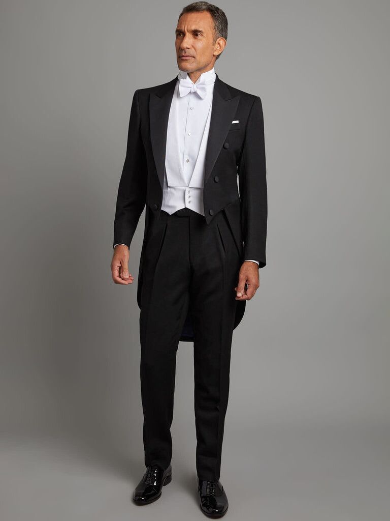 Formal tuxedo for a garden wedding by Oliver Brown. 