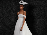 Empire cut tulle gown with off the shoulder sleeves