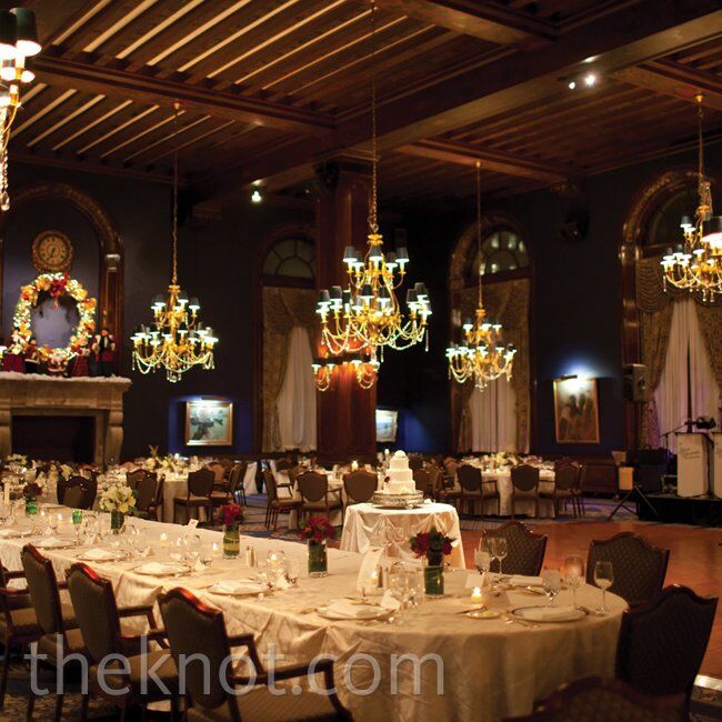 The Union League Club’s fireplaces, warm colors and Christmas decor set the perfect stage for the holiday-themed look. For the big entrance, bagpipers led the couple and the bridal party into the reception.