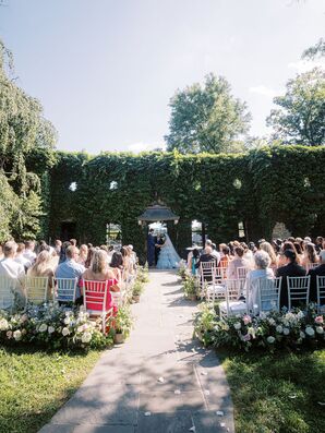 Outdoor Wedding Ceremony Against Boxwood Hedge Backdrop