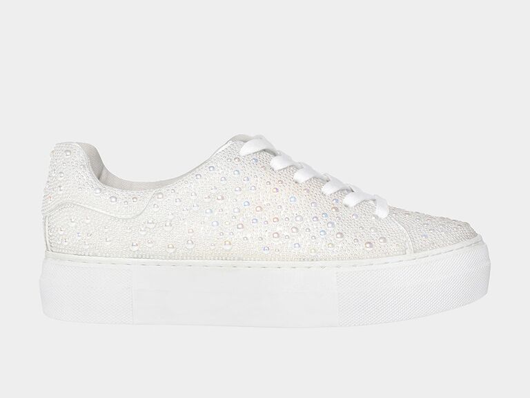 White sneakers with small pearl detailing. 