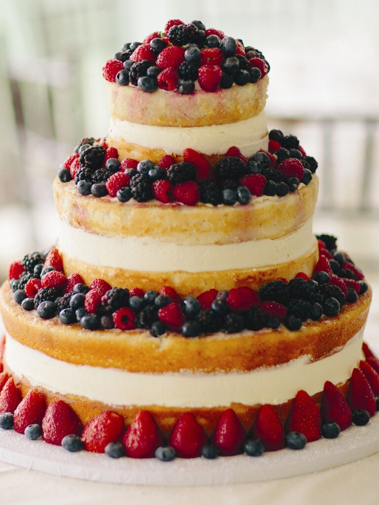 Three-tier naked bridal shower cake with fresh berries