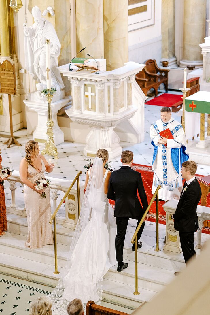 Bride in Long Veil and Groom With Bridal Party Stepping Up to Altar, Catholic Church