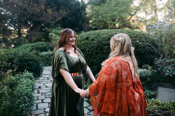 Bride in Green Dress Holding Hands With Bride in Orange Dress