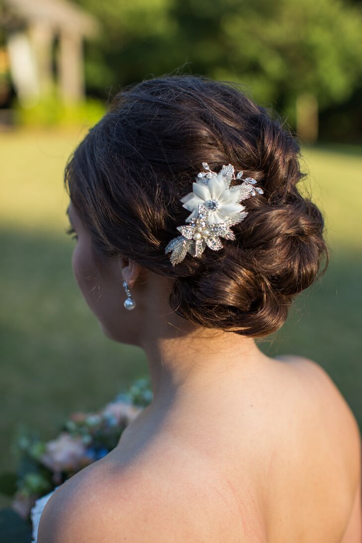 Sarah wore a pretty embellished floral hairpiece in her romantic bridal updo, matching her beaded dress and adding extra elegance to her already sophisticated style.