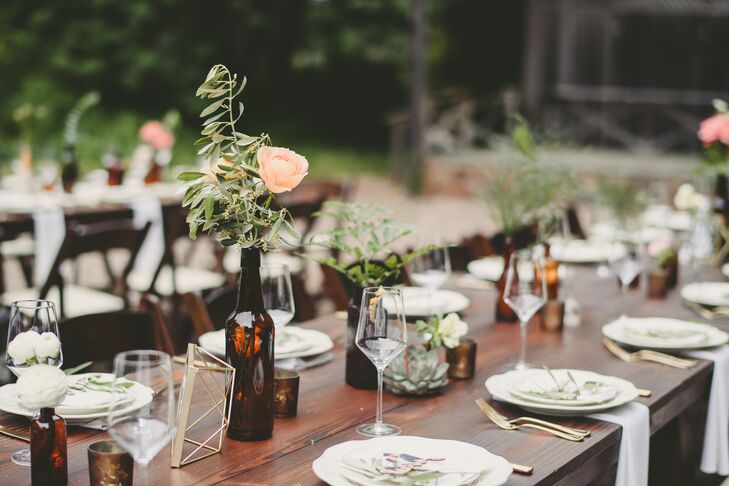 Tables were decorated with vintage brown glass bottles that Crystal and Keith had selected from around the country. The bottles were filled with blooms and greenery.