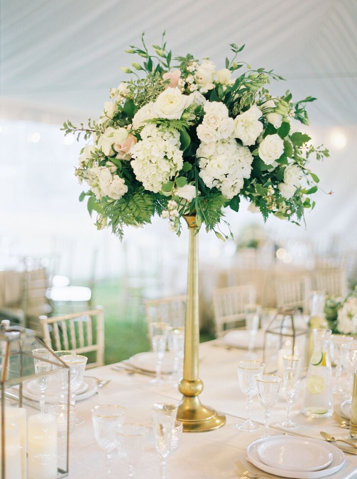 One single tall centerpiece for the reception table design is all that's needed to make a statement.
