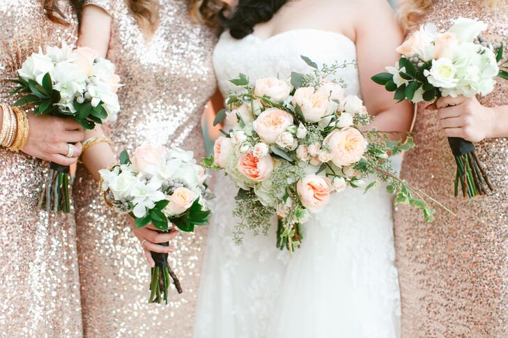 Vanessa chose lots of white and green flowers with peach garden roses for the bouquets.