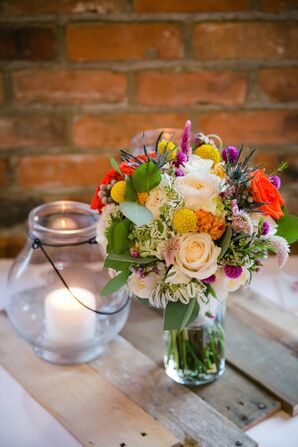 Colorful Craspedia and Blue Thistle Bouquet Centerpiece