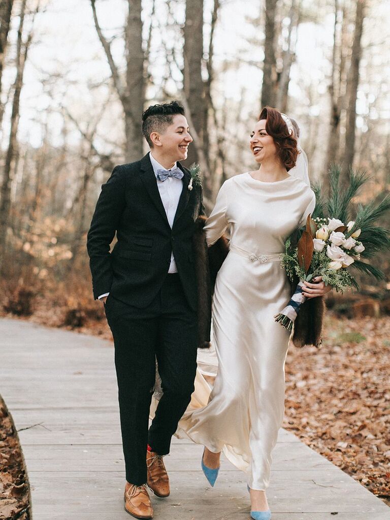 bride and bride in vintage-style attire and suit