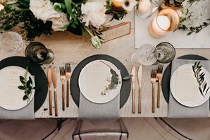 Dark Grey Chargers with Charcoal Linens, Gold Flatware and Herbs